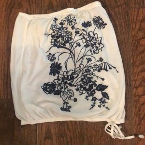 White with blue embroidery